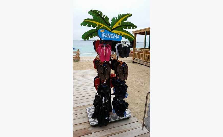 Lot of flip flops and sandals of beach