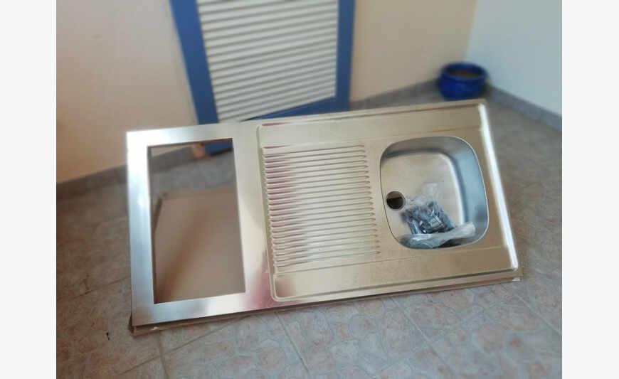 Stainless steel sink for kitchenette.