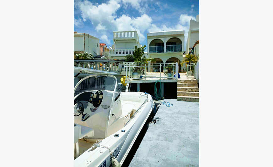 La Maison Bleue, with pontoon on the lagoon.